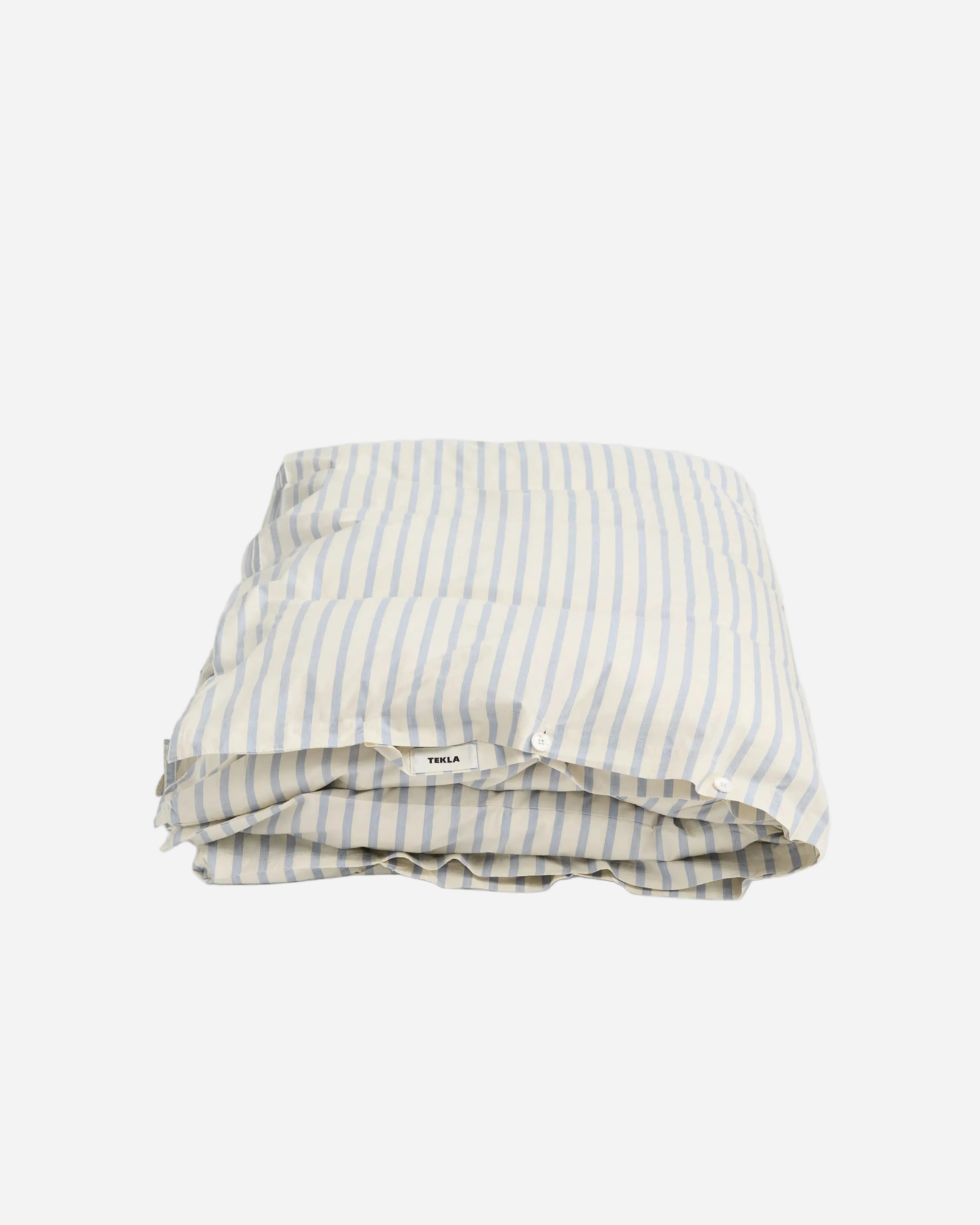 Striped fabric folded neatly on a light gray background